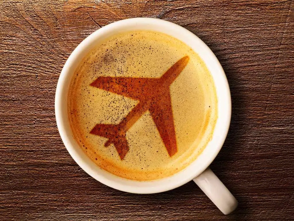 latte with airplane art in foam. 