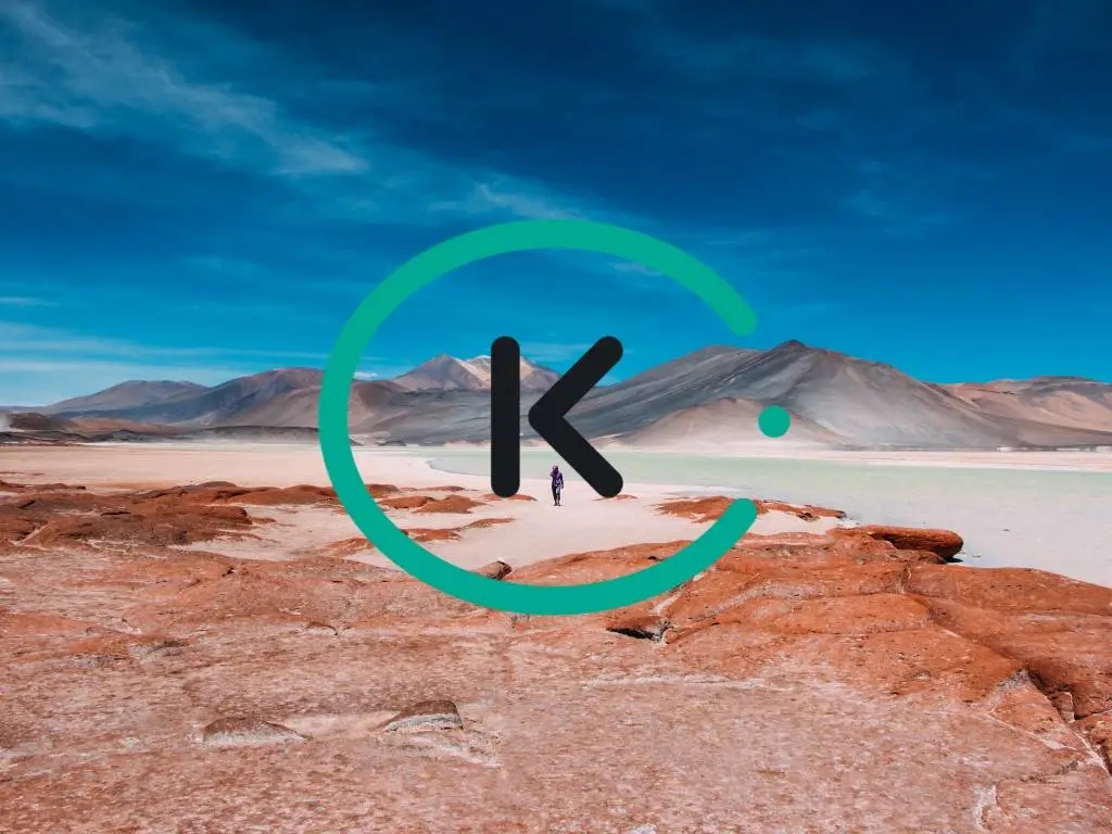 photo of person walking the Atacama desert with Kiwi logo on the image.