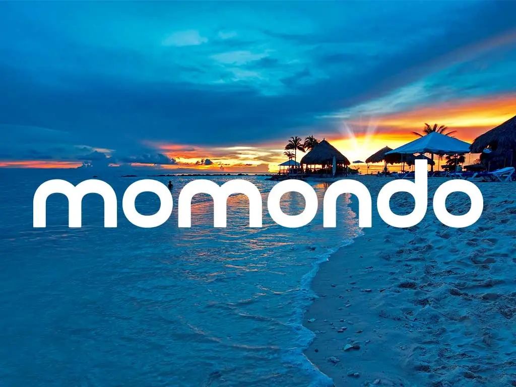 Beach in Curaçao with Momondo logo overlay