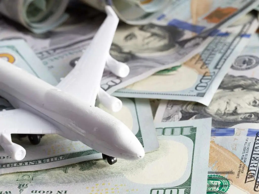 toy plane on currency